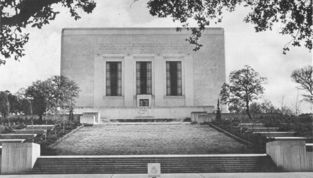 Museum exterior shown in black and white old photo