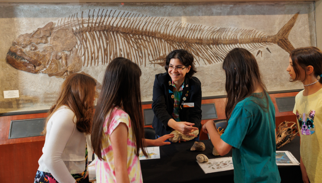 Children getting a hands-on fossil lesson