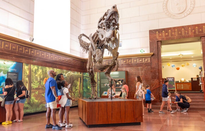 Family looking at Texas Tyrannosaur