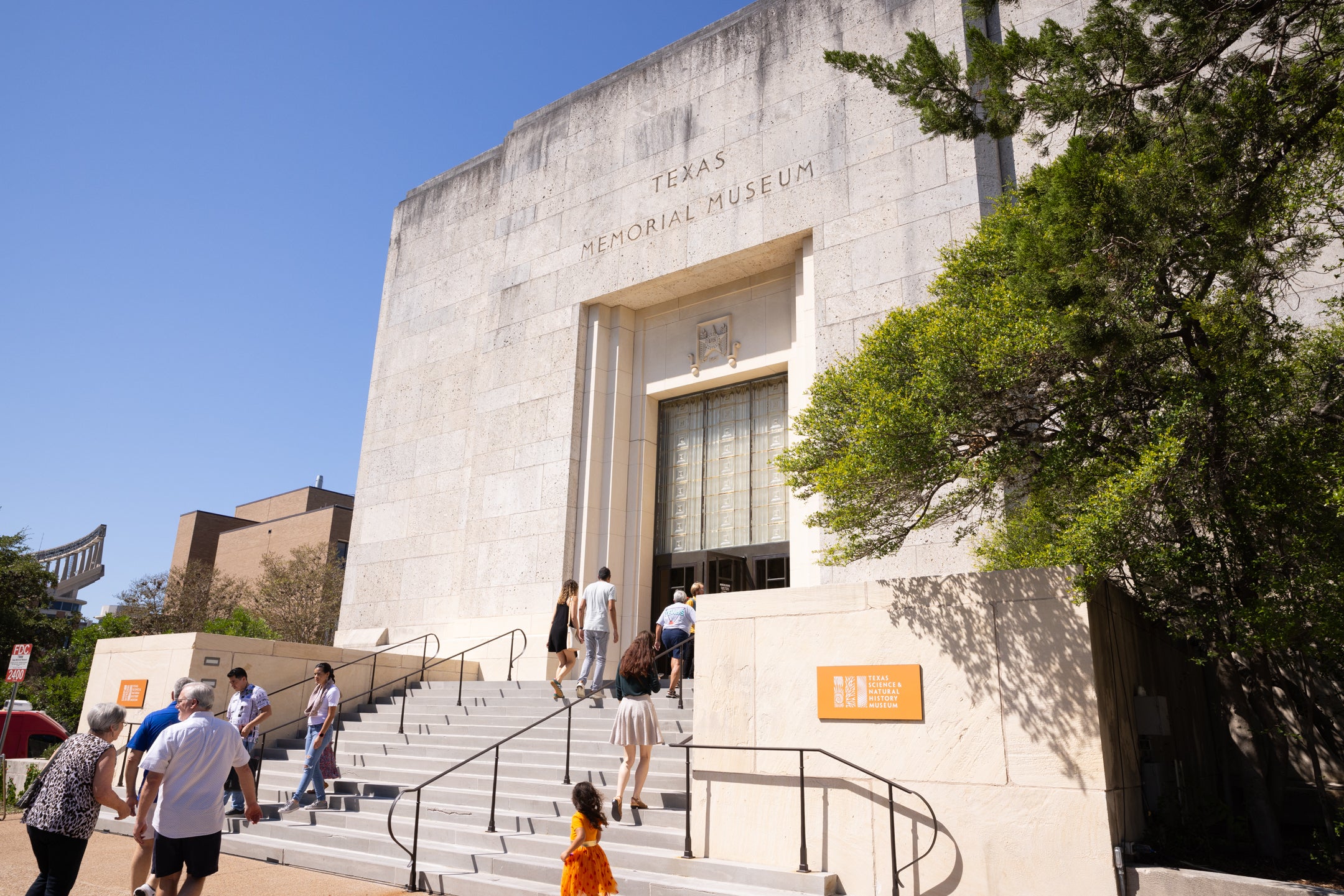 visitors walking up to front entrance at Texas Science & Natural History Museum